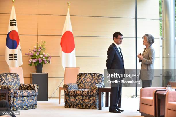 Taro Kono, Japan's foreign minister, left, and Kang Kyung-wha, South Korea's foreign minister, talk prior to the summit meeting with Japan's Prime...