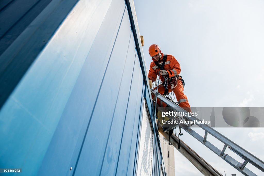 Firefighters in a rescue operation - accident on the roof