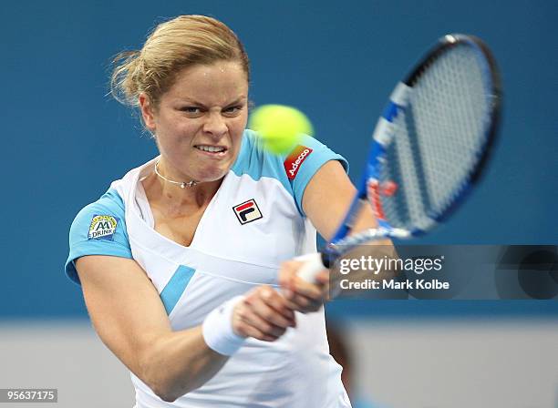 Kim Clijsters of Belgium plays a backhand in her semi-final match against Andrea Petkovic of Germany during day six of the Brisbane International...