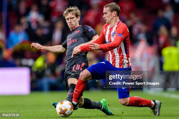 Nacho Monreal of Arsenal FC fights for the ball with Antoine Griezmann of Atletico de Madrid during the UEFA Europa League 2017-18 semi-finals match...