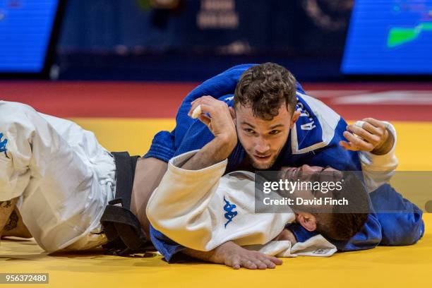 Adrian Gomboc of Slovenia holds Matteo Medves of Italy for an ippon to win the u66kg gold medal during day one of the 2018 Tel Aviv European Judo...