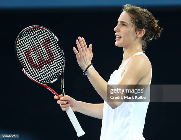 Andrea Petkovic of Germany voices her frustration to the umpire after a close line call in her semi-final match against Kim Clijsters of Belgium...