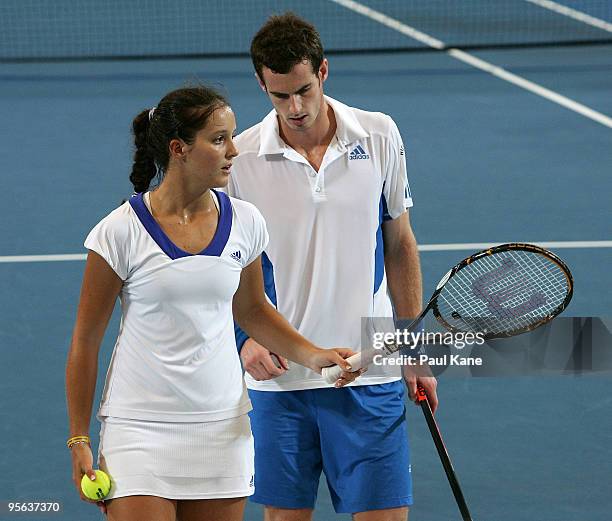 Laura Robson and Andy Murray of Great Britain talk tactics during their mixed doubles match against Igor Andreev and Elena Dementieva of Russia in...