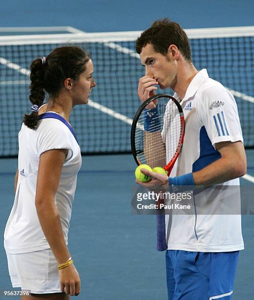 Laura Robson and Andy Murray of Great Britain talk tactics during their mixed doubles match against Igor Andreev and Elena Dementieva of Russia in...