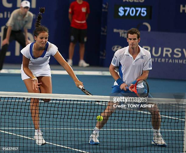 Andy Murray and Laura Robson of Britain return a shot against Igor Andreev and Elena Dementieva of Russia during their mixed doubles tennis match on...
