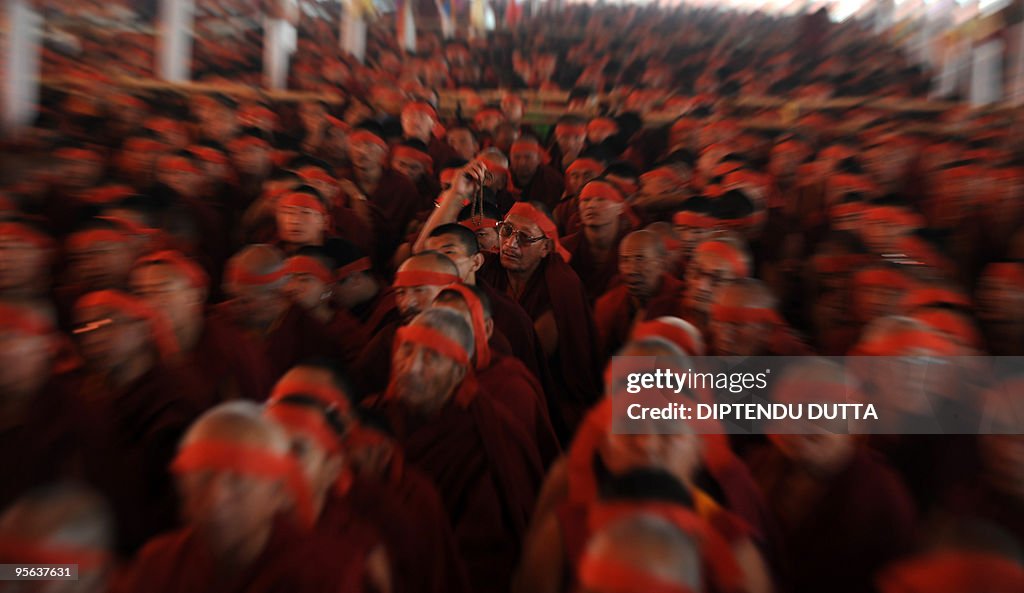 Buddhist monks wear red bandanas during