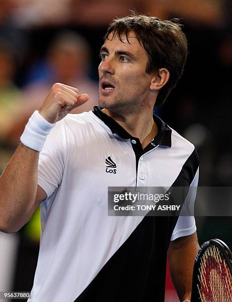 Tommy Robredo of Spain celebrates a point against Lleyton Hewitt of Australia during their singles match on the ninth session, day six of the Hopman...