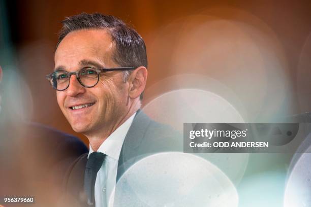 German Foreign Minister Heiko Maas smiles during the weekly cabinet meeting at the Chancellery in Berlin on May 9, 2018.