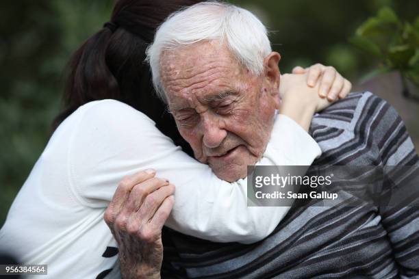 Australian botanist and academic David Goodall, who is 104 years old, gets a hug from Taiwanese actress and television hostess Bowie Tsang during the...