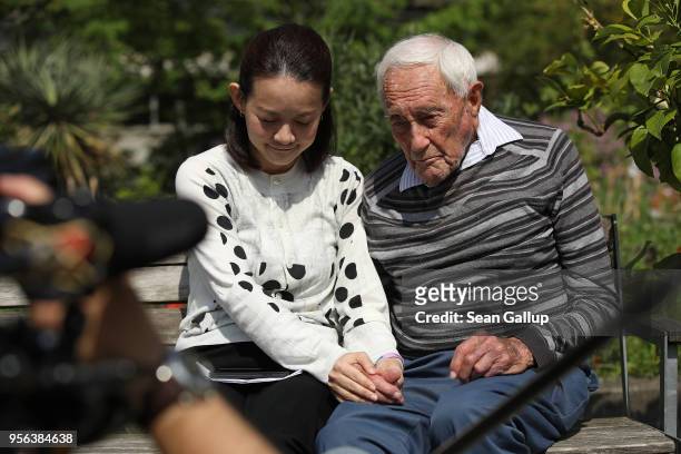 Australian botanist and academic David Goodall, who is 104 years old, holds hands with Taiwanese actress and television hostess Bowie Tsang during...