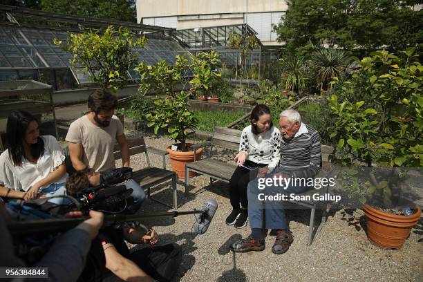 Australian botanist and academic David Goodall , who is 104 years old, chats with Taiwanese actress and television hostess Bowie Tsang during the...