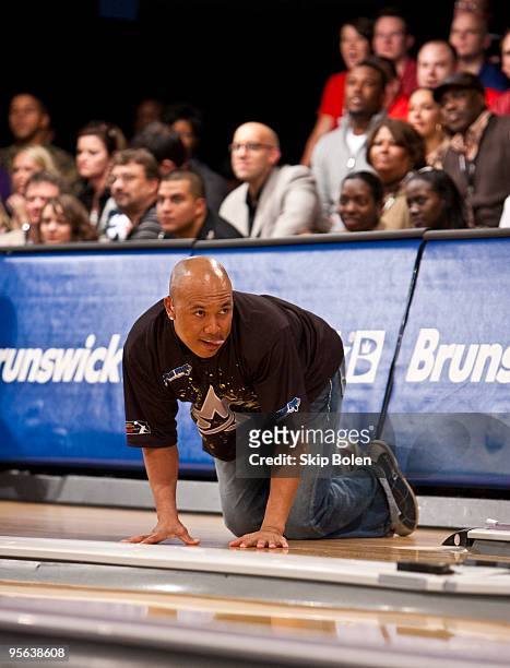 Hines Ward of the Pittsburgh Steelers on his hands and knees waiting for the results of his bowl at the PBA celebrity bowling fundraiser at Riverboat...
