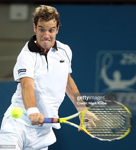 Richard Gasquet of France plays a backhand in his quarter-final match against Andy Roddick of the USA during day six of the Brisbane International...