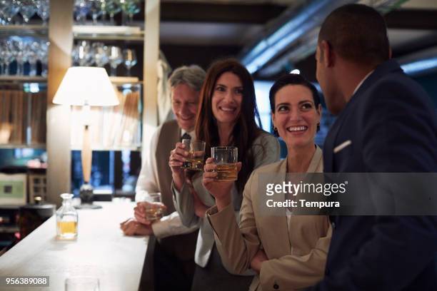 business retreats, drinking in the bar, happy hour. - country club woman stock pictures, royalty-free photos & images