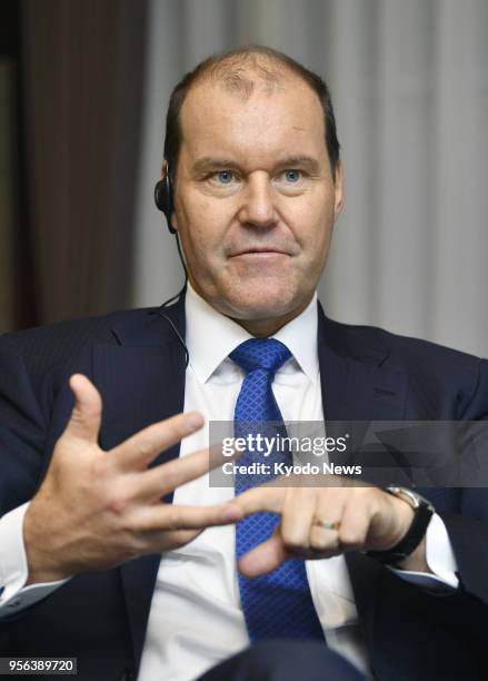 Takeda Pharmaceutical Co. President Christophe Weber speaks in an interview with Kyodo News in Tokyo on May 9 following the company's deal to acquire...