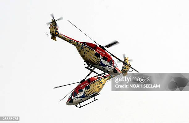 Indian army aerobatic team fly Sarang helocopters as they display their skills during a reunion of The Corps of Electronics and Mechanical Engineers...