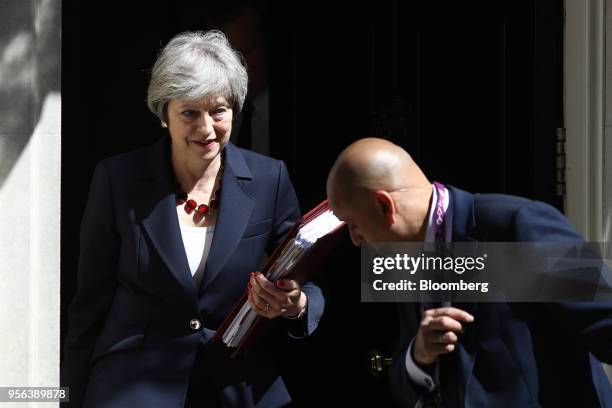 Theresa May, U.K. Prime minister, departs number 10 Downing Street to attend a weekly questions and answers session in Parliament in London, U.K., on...