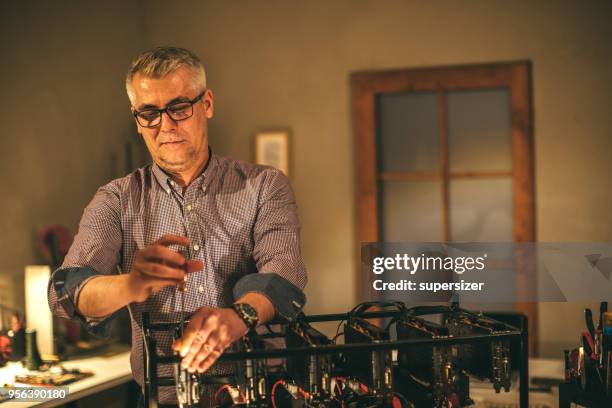 senior working on mining rig - rigips stock pictures, royalty-free photos & images