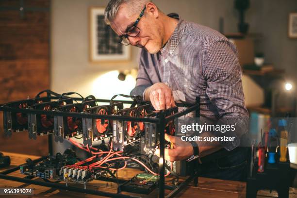 senior working on mining rig - rigips stock pictures, royalty-free photos & images