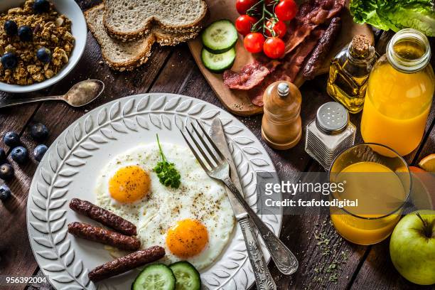 fried eggs in a plate for breakfast - pepper mill stock pictures, royalty-free photos & images