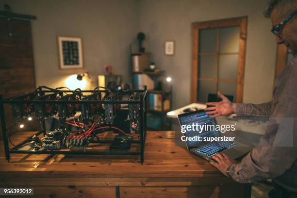 senior working on mining rig - rigips stock pictures, royalty-free photos & images