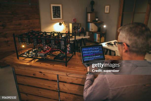 senior working on mining rig - rigips stock pictures, royalty-free photos & images