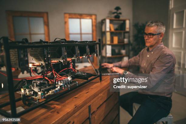 senior working on mining rig - rigips stock pictures, royalty-free photos & images