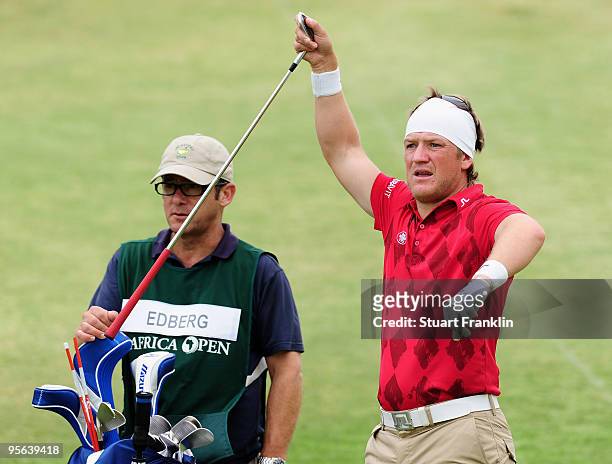 Pelle Edberg of Sweden and caddie on the 18th hole during the second round of the Africa Open at the East London Golf Club on January 8, 2010 in East...