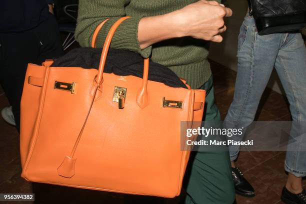 Model Irina Shayk, Hermes Birkin handbag detail, is seen during