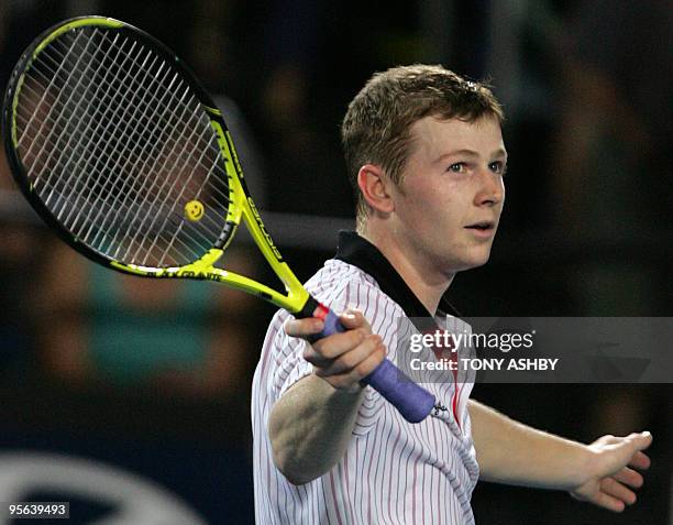 Andrey Golubev of Kazakhstan celebrates his win against Igor Andreev of Russia after their singles match on the eighth session, day five of the...