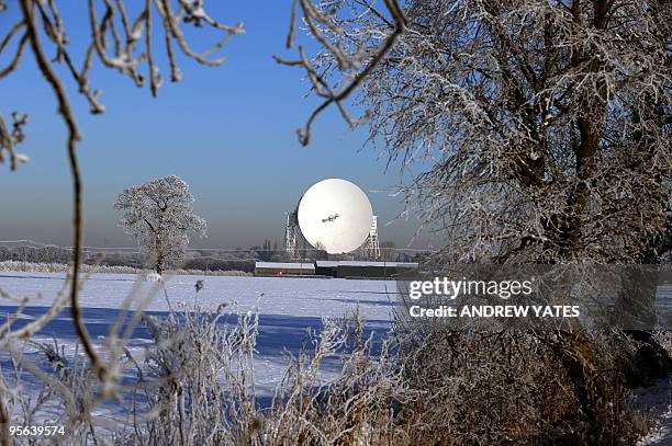 The world famous Lovell Radio Telescope is pictured on snow covered fields in Macclesfield, north-west England on January 8 Since the summer of 1957...