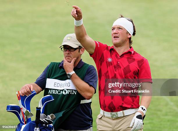 Pelle Edberg of Sweden and caddie on the 18th hole during the second round of the Africa Open at the East London Golf Club on January 8, 2010 in East...