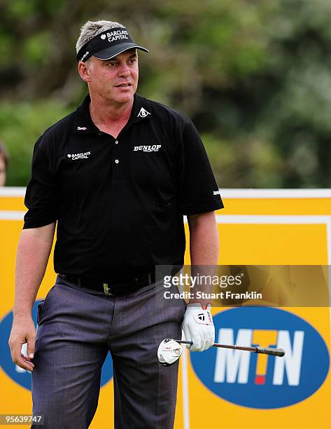 Darren Clarke of Northern Ireland watches his tee shot on the eighth hole during the second round of the Africa Open at the East London Golf Club on...