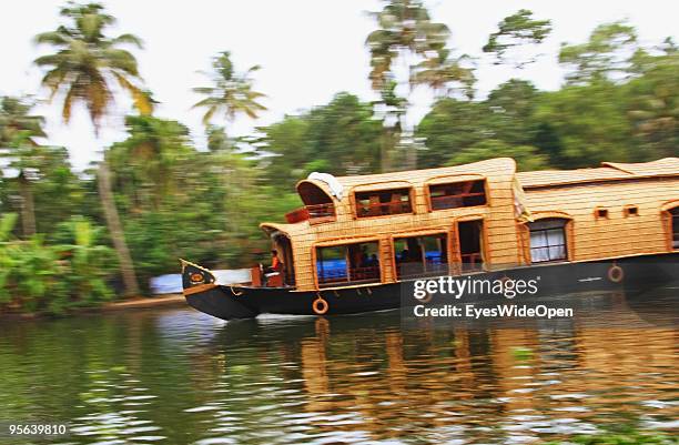 Traditional kettu vallam houseboats cruising the famous backwaters of Alleppey on December 25, 2009 in Alapuzha near Trivandrum, Kerala, India....