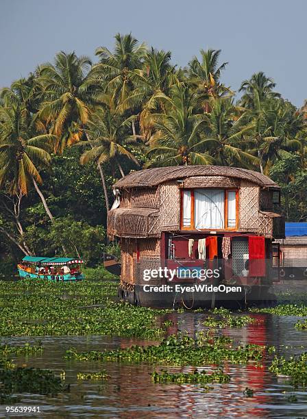 Traditional kettu vallam houseboats cruising the famous backwaters of Alleppey on December 25, 2009 in Alapuzha near Trivandrum, Kerala, India....