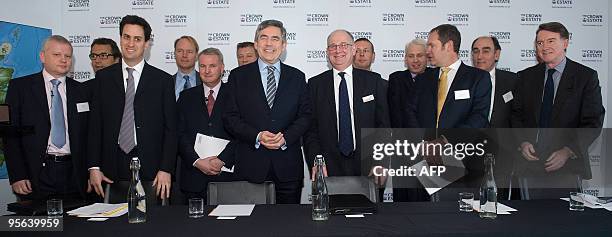 British Prime Minister Gordon Brown poses for photographs with the CEO's and representatives of nine energy companies before he announces plans for a...