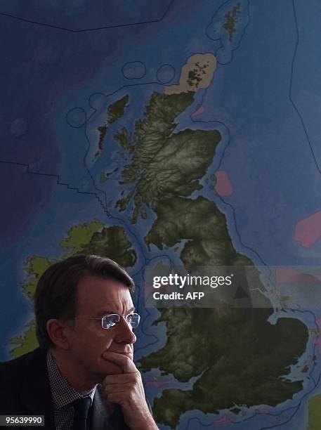 British Business Secretary Lord Mandelson listens as Prime Minister Gordon Brown announces plans for a new initiative to build off-shore wind farms...