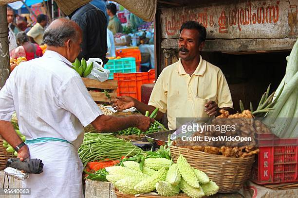 Local vendor sells beans at his vegetable stall at the food market of Kottayam on December 28, 2009 in Kottayam near Trivandrum, Kerala, India.