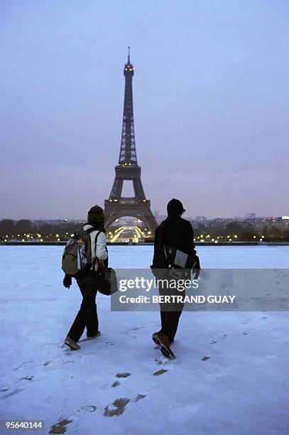 People walk on the snow-covered Trocadero esplanade near the Eiffel Tower on January 7, 2010 in Paris, as Europe shivered in bitterly cold...