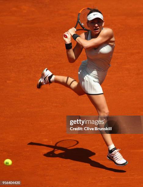 Simona Halep of Romania plays a backhand against Kristyna Pliskova of the Czech Republic in their third round match during day five of the Mutua...