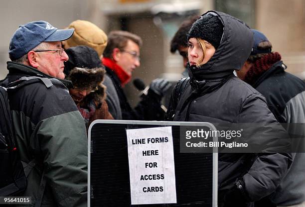 People line up in the cold outside of the Federal Courthouse to get one of 77 access tickets for the arraignment of suspected terrorist Umar Farouk...