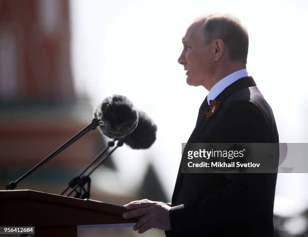 Russian President Vladimir Putin speaks during the Victory Day military parade at Red Square on May 9, 2018 in Moscow, Russia. Vladimir Putin and...