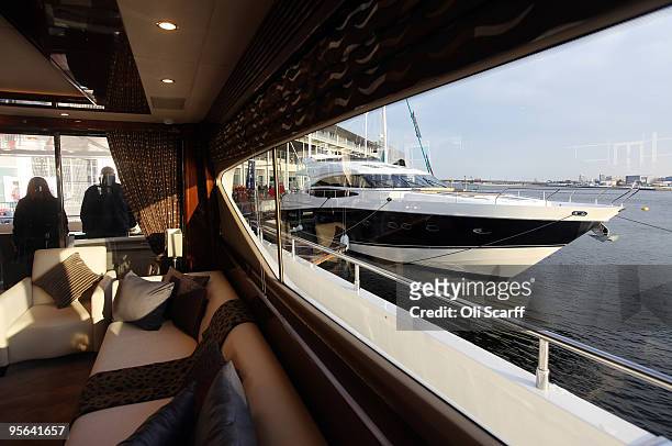 An 85 foot long Princess power boat is seen from the living room of a 96 foot long Princess boat moored in Royal Victoria Dock adjacent to the ExCeL...