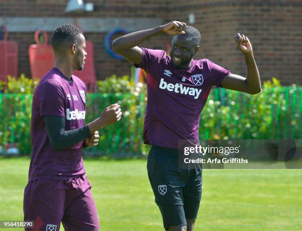 Edimilson Fernandes and Cheikhou Kouyate of West Ham United during training at Rush Green on May 9, 2018 in Romford, England.