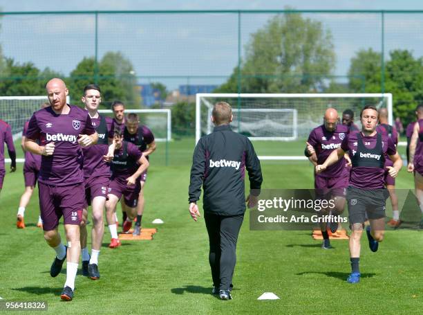 James Collins and Mark Noble of West Ham United during training at Rush Green on May 9, 2018 in Romford, England.