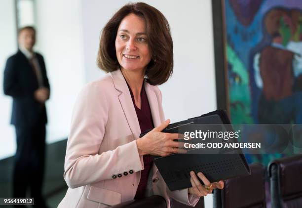 German Justice Minister Katarina Barley holds a folder at the start of the weekly cabinet meeting at the Chancellery in Berlin on May 9, 2018.
