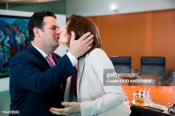 German Justice Minister Katarina Barley and German Labour Minister Hubertus Heil greet each other as they arrive for the weekly cabinet meeting at...