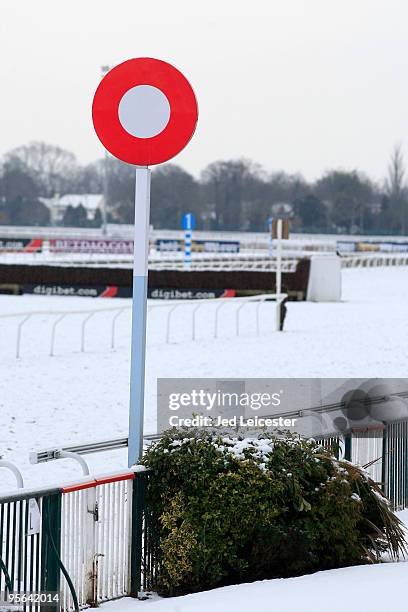 The finishing post stands surrounded by snow as winter race meetings at the Kempton Park race course are cancelled due to the snowy conditions on...