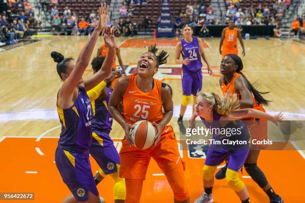 May 7: Alyssa Thomas of the Connecticut Sun looks to shoot while defended by Mistie Bass of the Los Angeles Sparks during the Connecticut Sun Vs Los...
