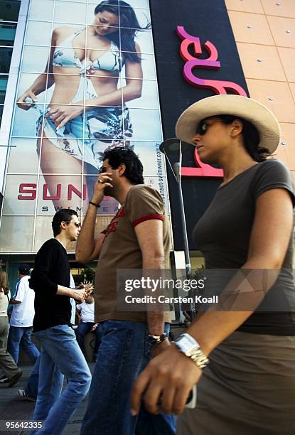 Fashionable dressed young turks passing a advertising billboard at the store Boyner on May 29, 2005 in Istanbul, Turkey. Today Boyner, as a member of...